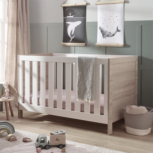 Silver Cross Finchley Oak Cot Bed Angled in Lifestyle Image
