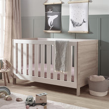 Load image into Gallery viewer, Silver Cross Finchley Oak Cot Bed Angled in Lifestyle Image
